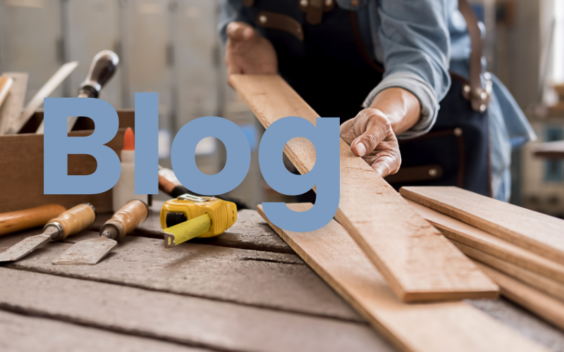 A man doing wood working with the word "blog" written.